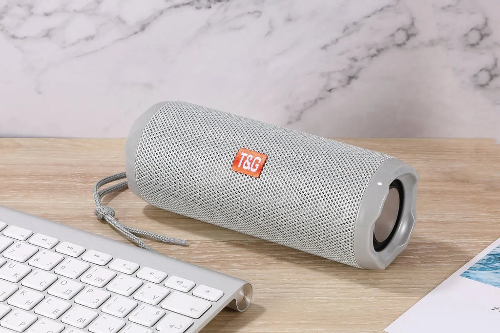 Fabric-covered portable Bluetooth speaker with card holder in multiple colour options