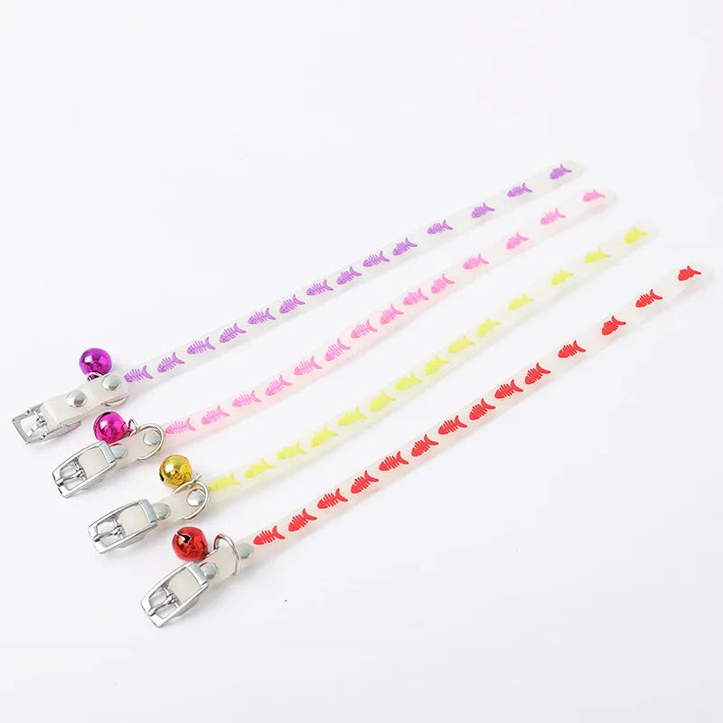 Luminous adjustable cat collar with a metal bell in a paw print pattern on a silicone rope.
