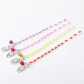 Luminous adjustable cat collar with a metal bell in a paw print pattern on a silicone rope.