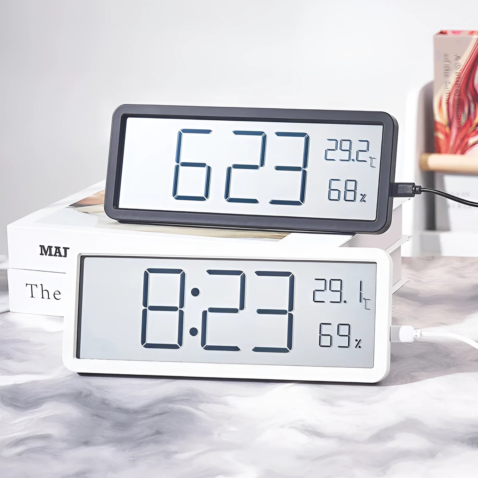Simple large screen temperature and humidity clock with plastic shell in white Nordic style on a desk