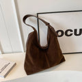 Retro PU shoulder bag with suede stitching and bucket shape in brown colour