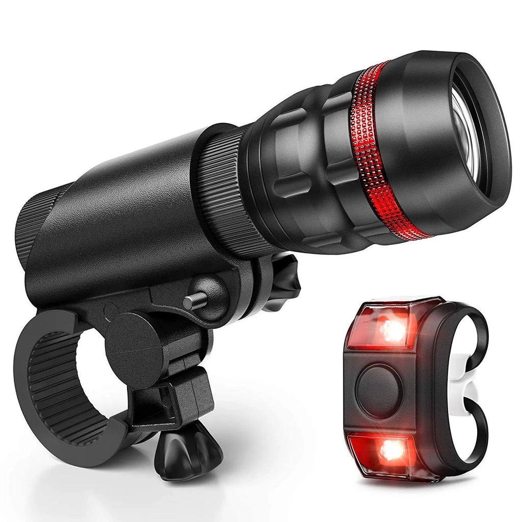 Bicycle headlight and taillight set with mounting bracket on a bike handlebar.