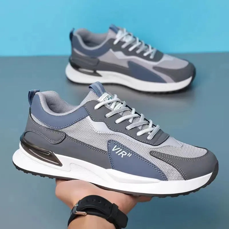 Men's colour block mesh sneakers in black, grey, or white with lace-up design and round toe.