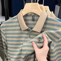 Man wearing a red striped casual short sleeve polyester shirt with a mosaic pattern.