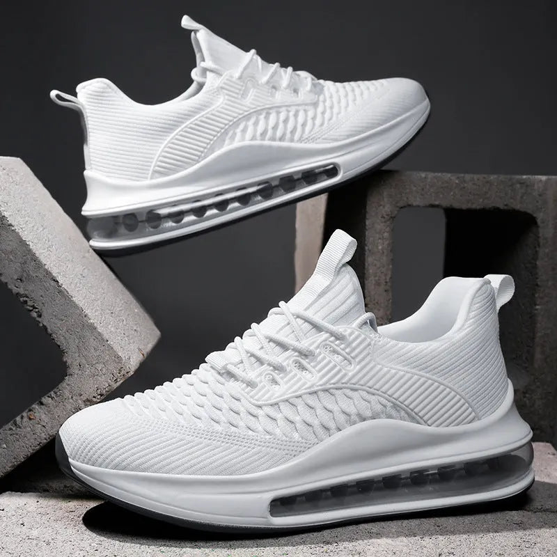 Men's black low-top lace-up running sneakers with mesh upper on a white background.