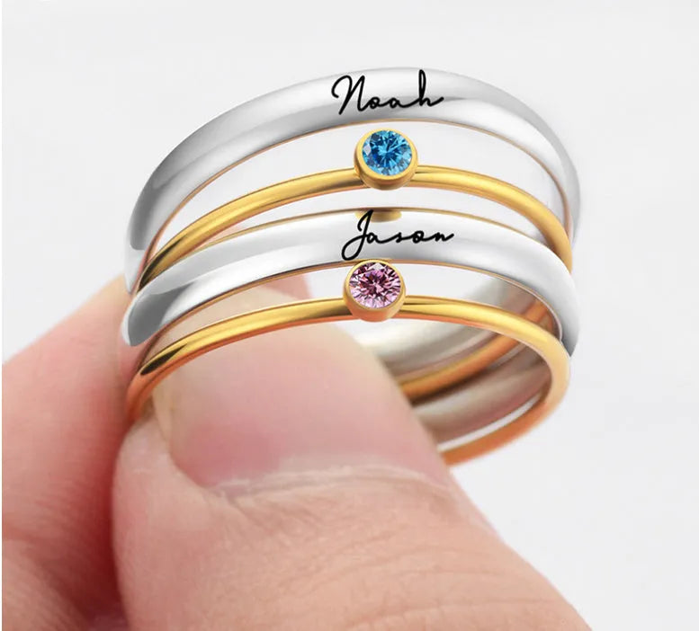 December birthstone geometric engraved ring in titanium steel on a hand.