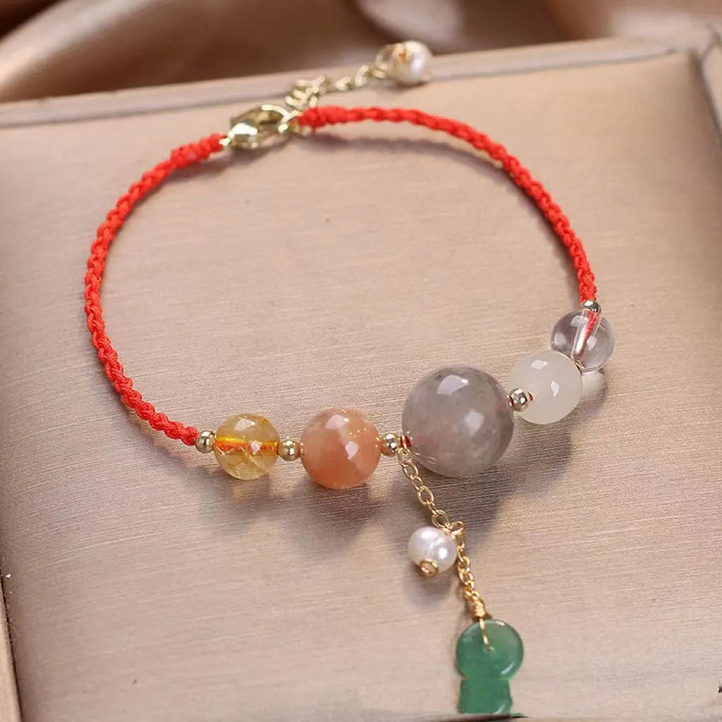 Hand-woven women's bracelet with peace buckle, crystal and sequin accents in red, green and blue colour options