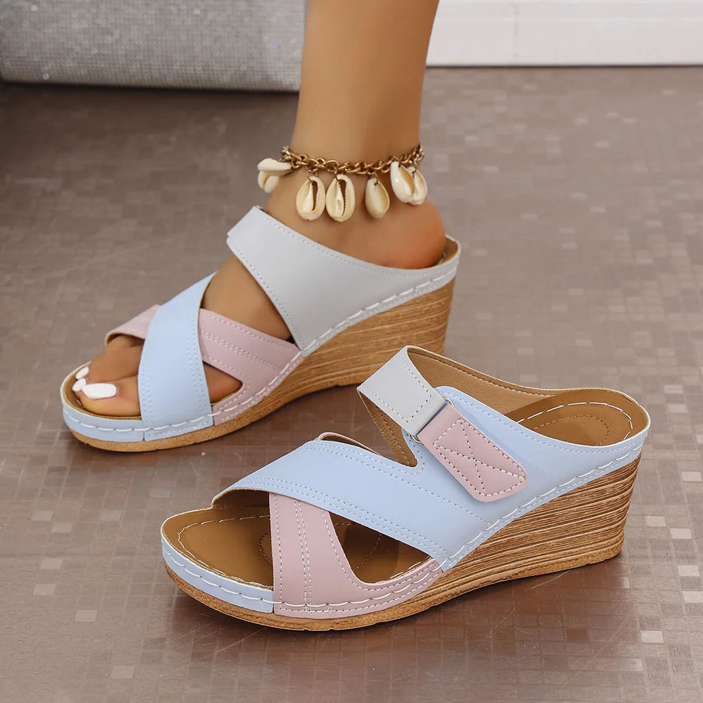 Women's velcro strap wedge slippers in a fish mouth design, shown in various colour options.