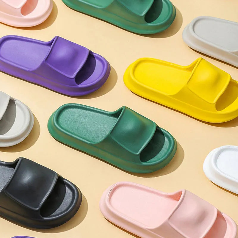 Soft EVA flip-flop slippers with a thick sole, shown in multiple colours including black, pink, and grey.