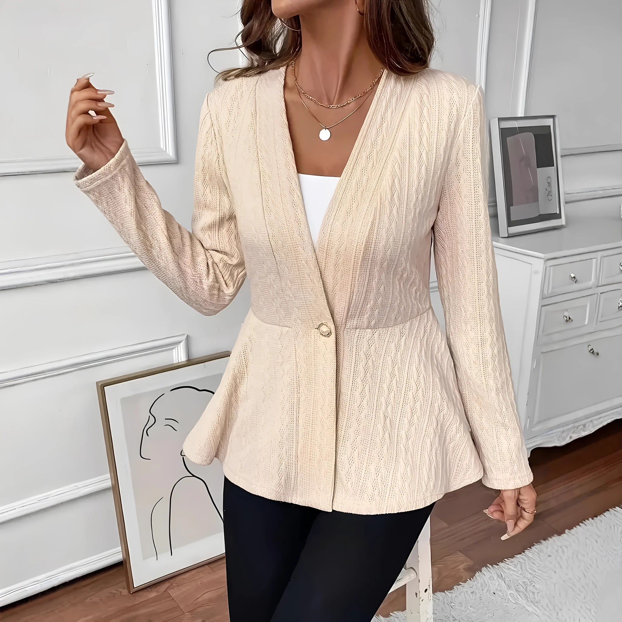 Women's apricot coloured Jacquard patterned knitted cardigan with one button front.
