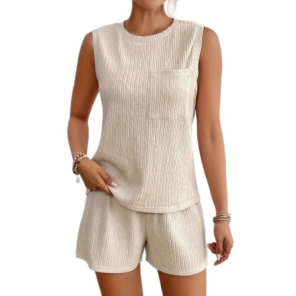 Women's apricot polyester vest and shorts set laid flat, showing round neck and elasticated waist.