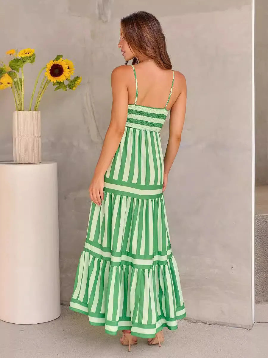 Women's striped backless summer dress with shoulder suspenders and square neckline showing integrated pockets