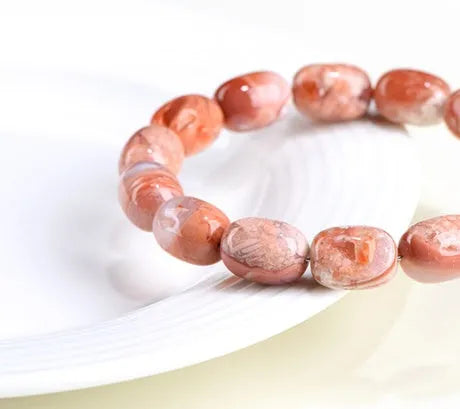 Natural cherry agate barrel bead bracelet with Ruyi design, 10x14mm beads on wrist
