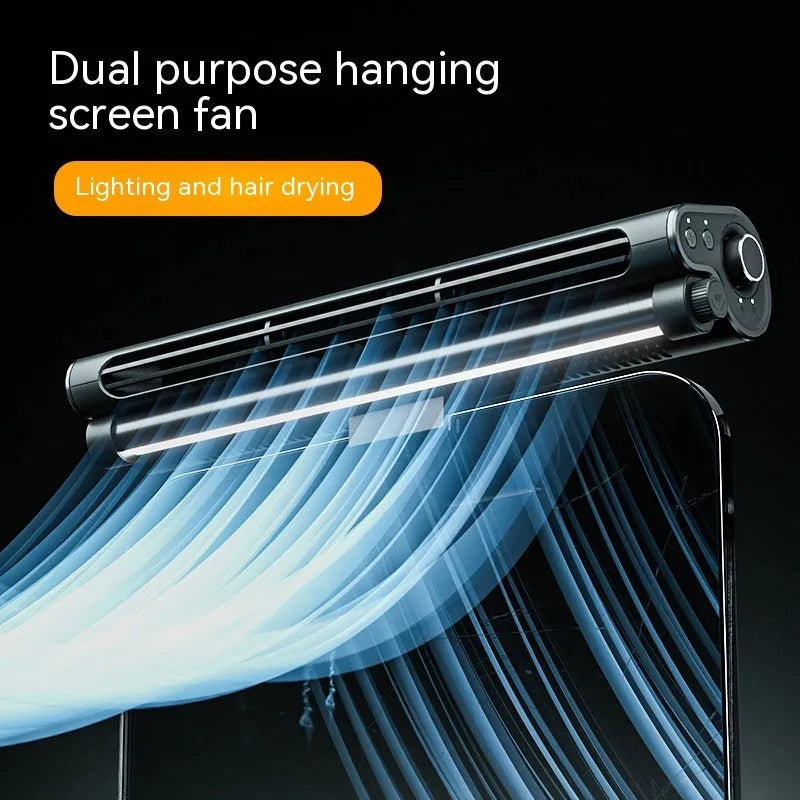 Black bladeless USB desk fan with an integrated lamp, shown clipped to the top of a laptop screen.