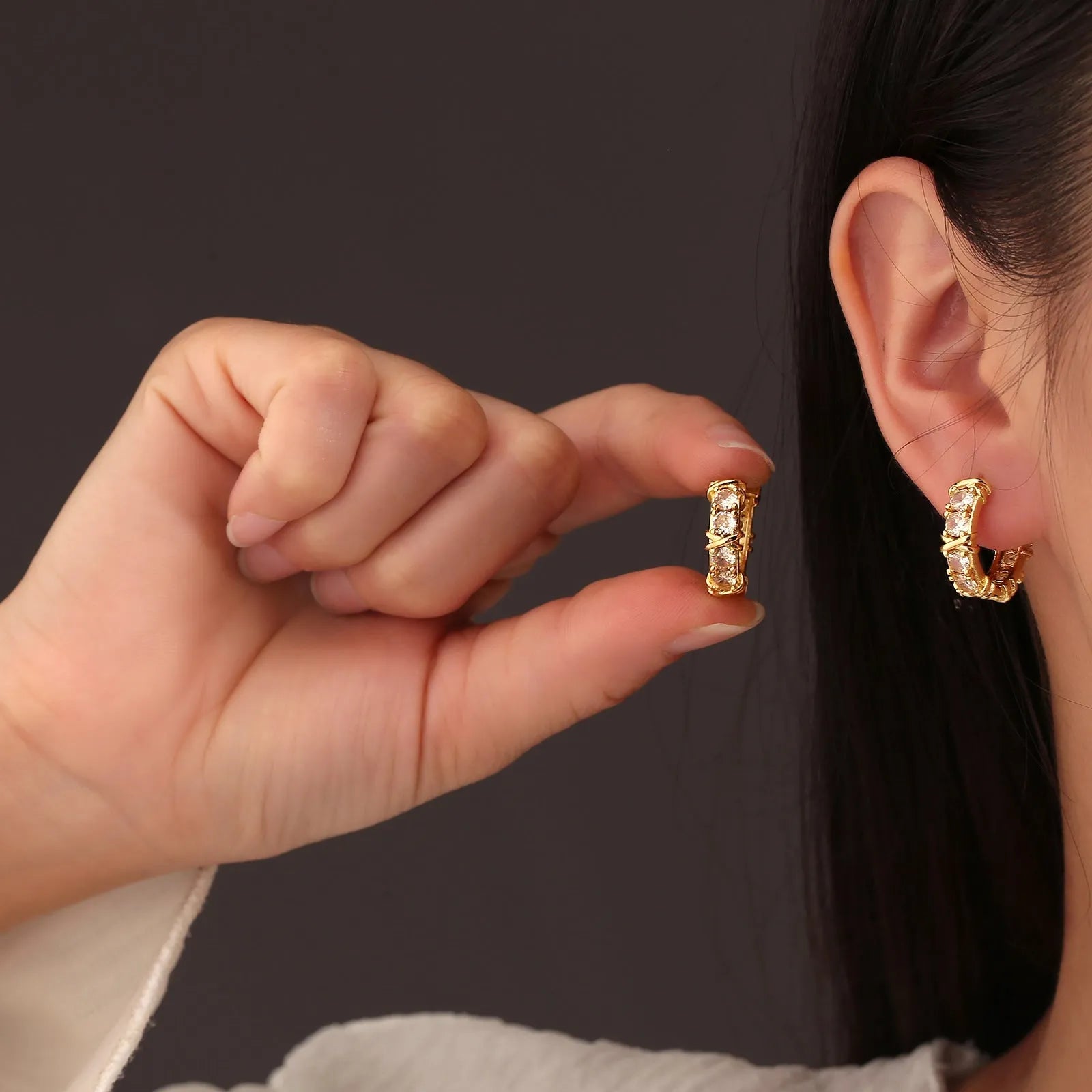 Geometric hexagonal earrings with clover cross design and elliptical accents in electroplated silver or gold finish