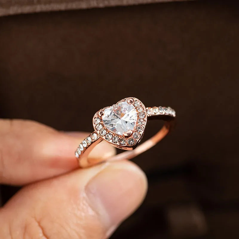 Heart-shaped crystal wedding ring with electroplated rose gold finish on white copper band