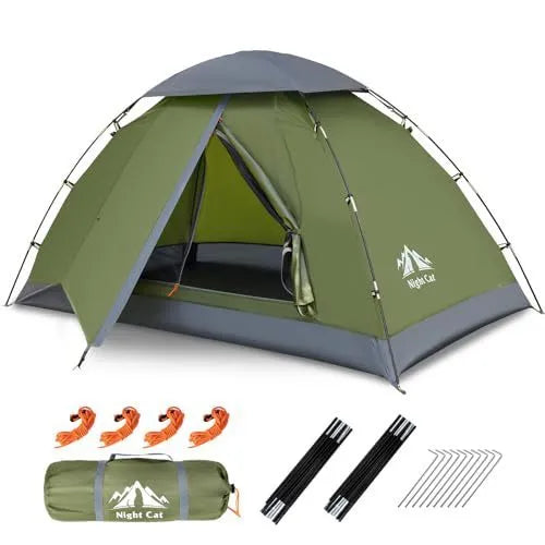 Dark green automatic pop up camping tent fully pitched in an outdoor setting