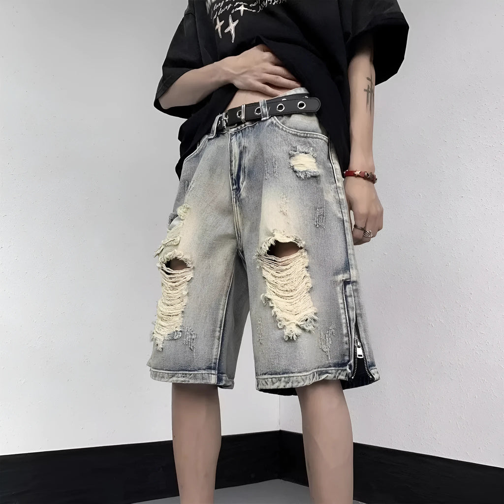 Blue retro tattered denim shorts with wide leg cut on mannequin