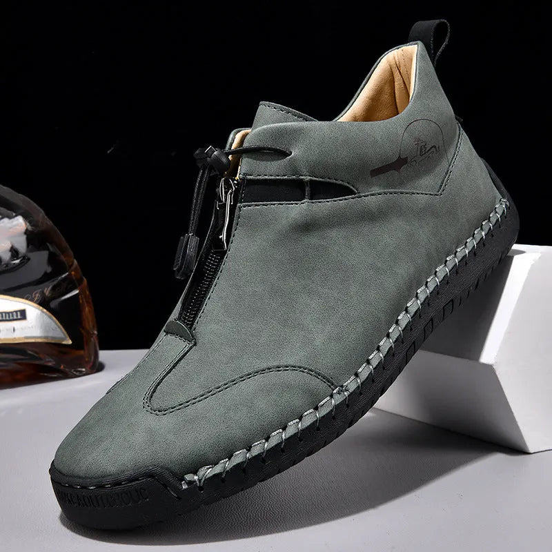 Casual men's leather shoe in green with round toe, mid heel, and decorative stitching