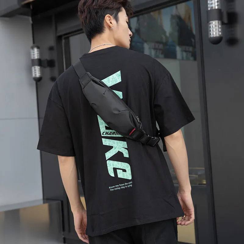 Black Oxford cloth waist pack with crossbody strap showing multiple interior compartments
