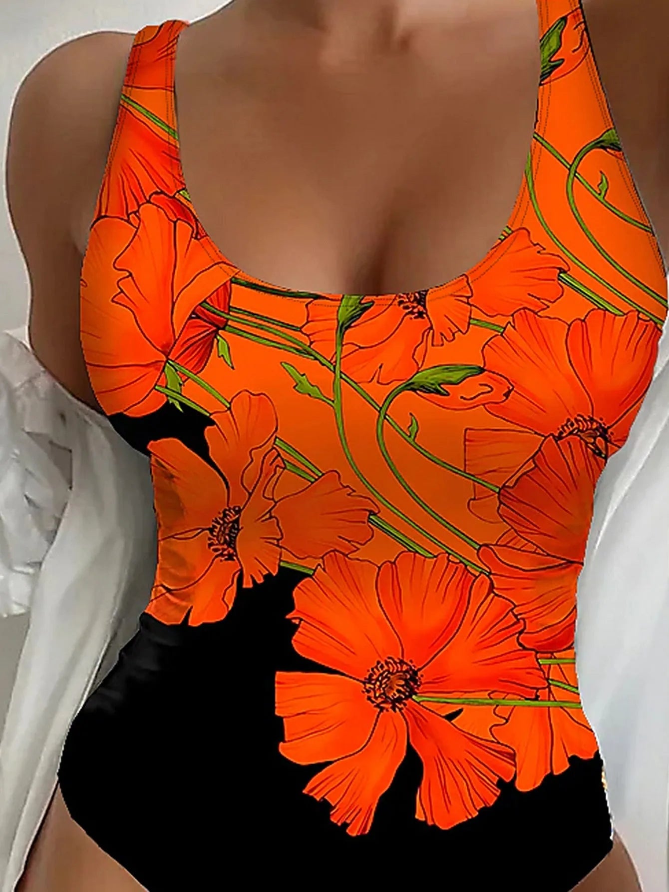 Orange floral print slim fit backless one-piece swimsuit on a mannequin.