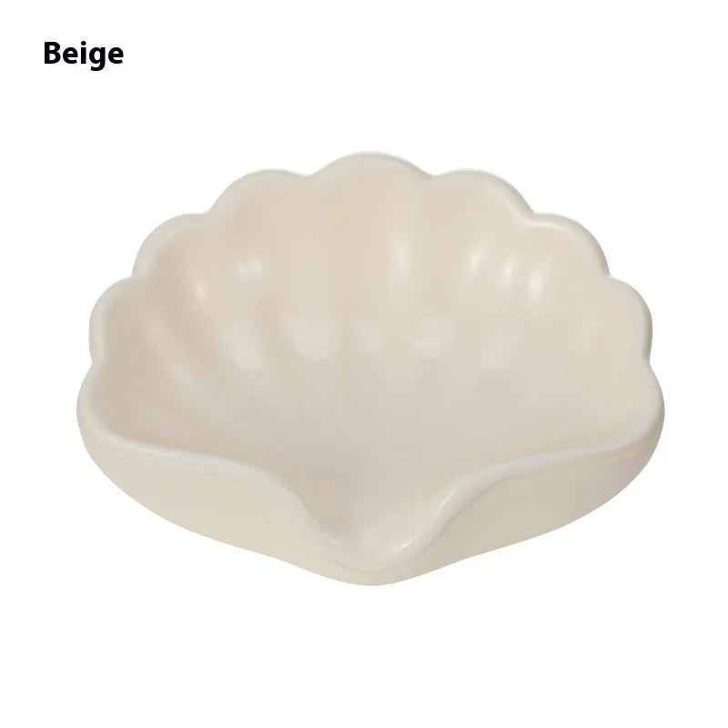 Plastic shell-shaped soap dish in pearl white or cherry blossom pink for bathroom organisation