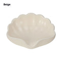 Plastic shell-shaped soap dish in pearl white or cherry blossom pink for bathroom organisation