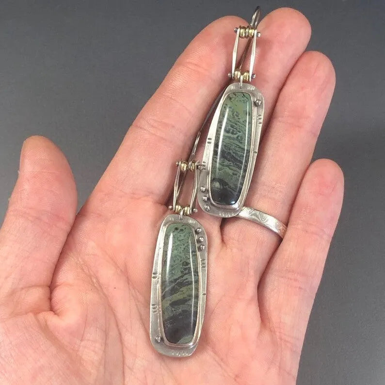 Geometric alloy earrings with two-colour marble pattern, showing angular shape and blended colour effect