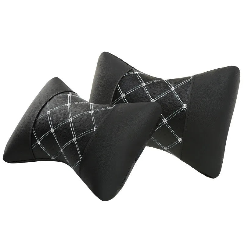 Black quilted car headrest cushion with diamond pattern for neck support.