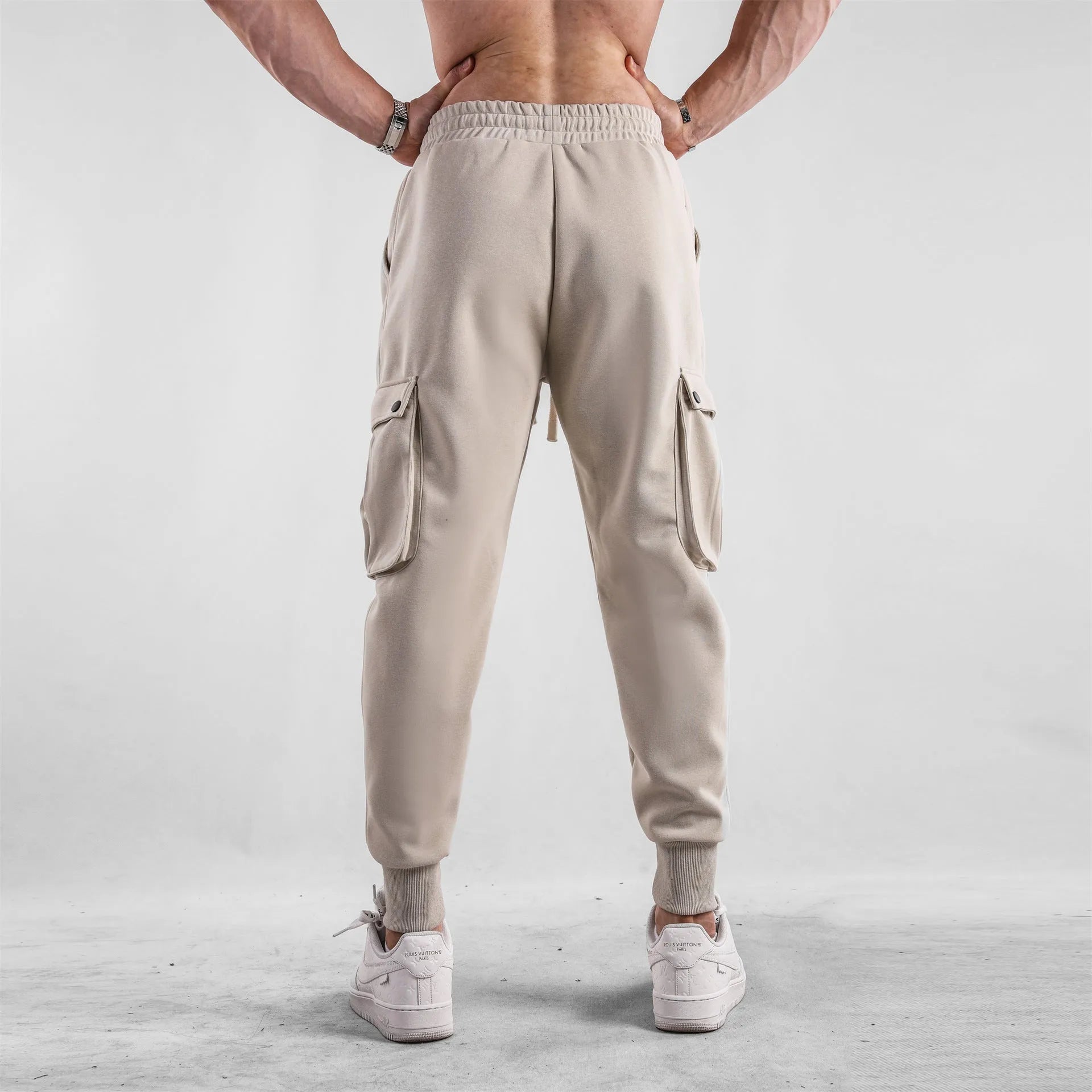 Men's loose cotton sports trousers with ankle ties and multiple pockets in various colours