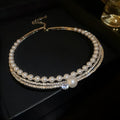 Round curved geometric silver-tone necklace with exaggerated design for collarbone enhancement