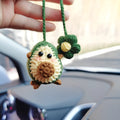 Handmade crocheted avocado-shaped and rainbow pattern car pendants made from wool yarn.