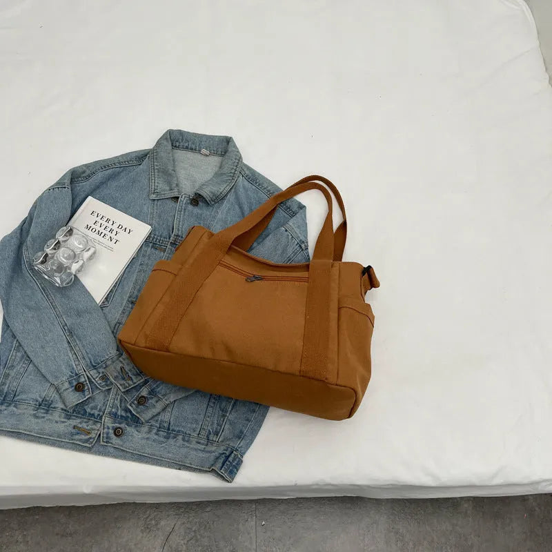 Large capacity polyester shoulder bag for women in four colours with mobile phone compartment