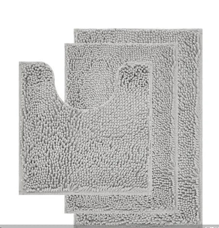 Chenille three-piece bathroom toilet mat set with U-shaped grey mat and rectangular mats on tiled floor.