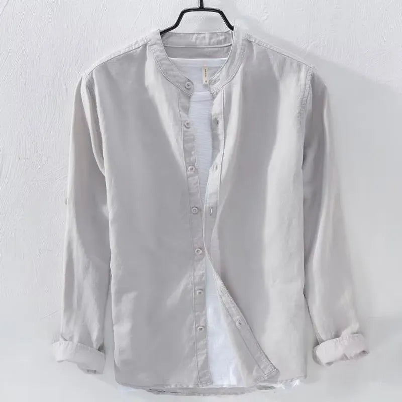 Man wearing a loose fit light blue long sleeve linen casual shirt