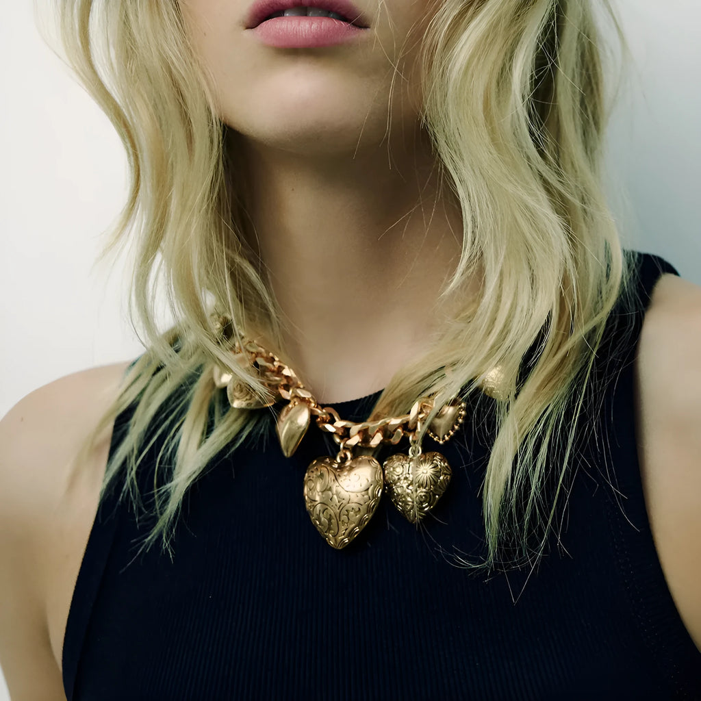 Exaggerated heart pendant necklace with dripping oil treatment in gold colour