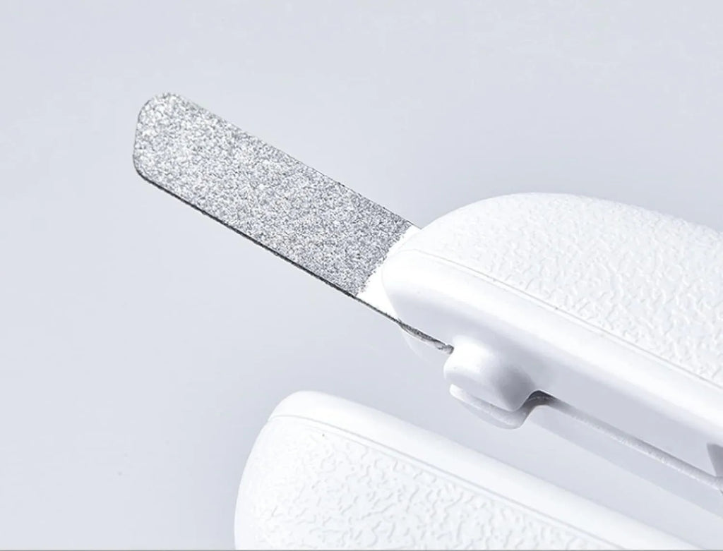 White LED pet nail clippers for dogs and cats with a transparent safety guard and leather-like handle.