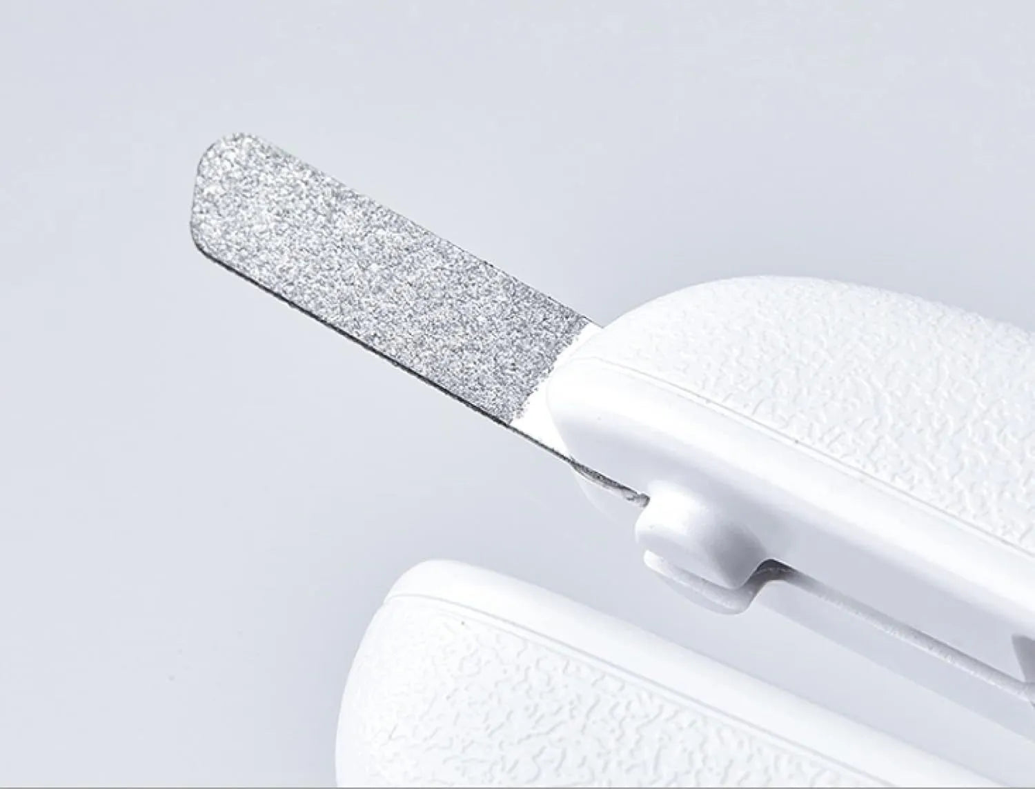 White LED pet nail clippers for dogs and cats with a transparent safety guard and leather-like handle.