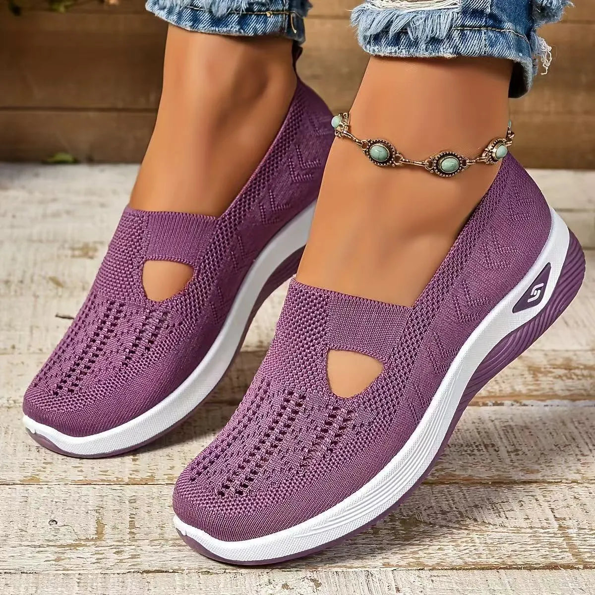 Women's low-top mesh casual shoes with a T-strap, flat heel, and round toe in various colours.