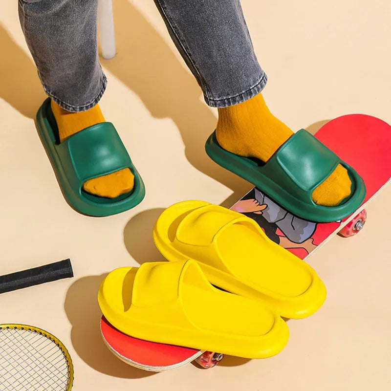Soft EVA flip-flop slippers with a thick sole, shown in multiple colours including black, pink, and grey.