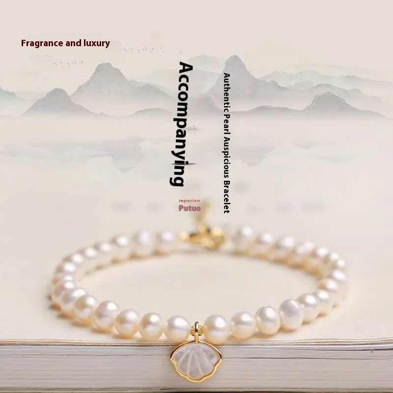 Women's freshwater pearl fan bracelet with 5-6mm pearls on elastic or chain fitting