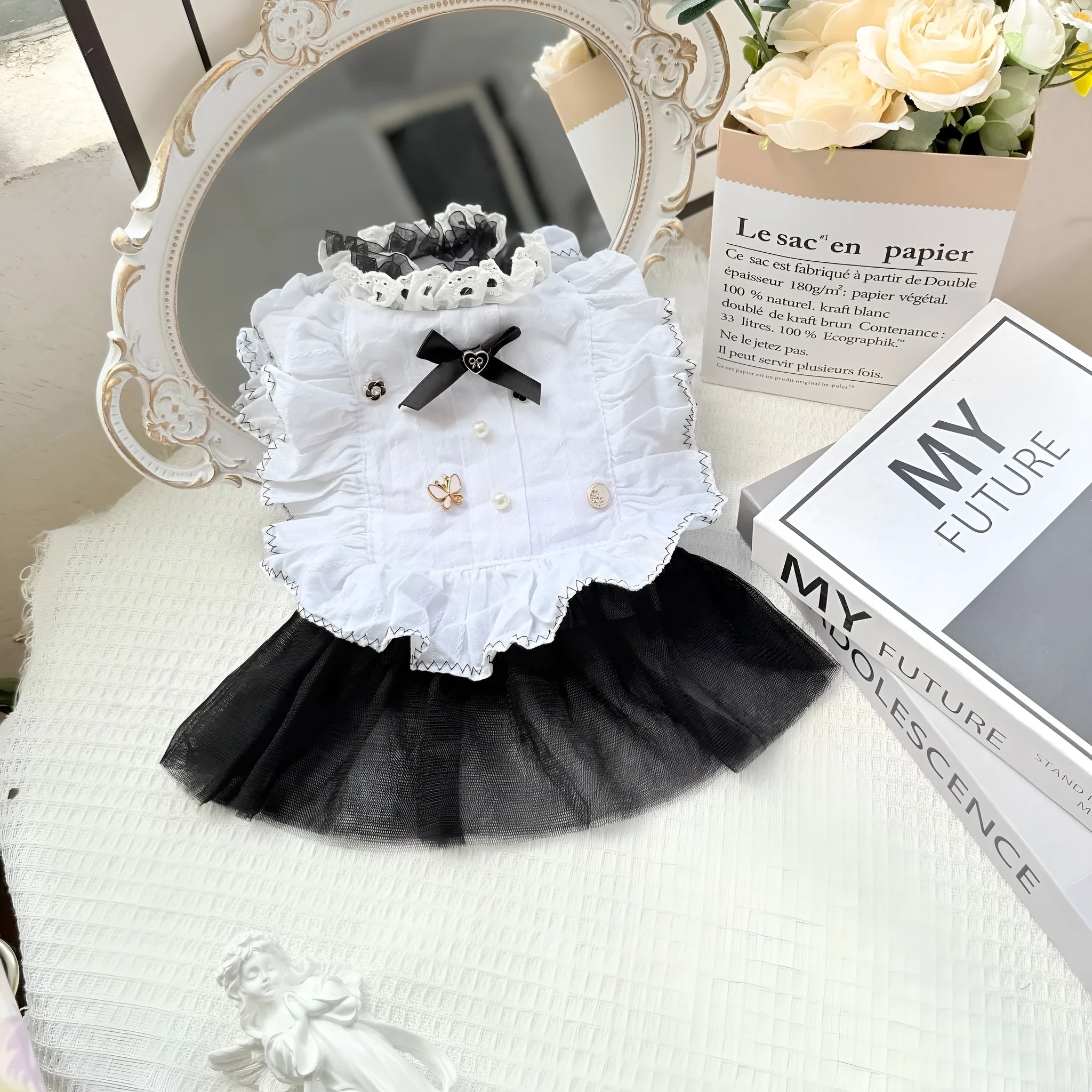 White polyester princess-style waltz gauze skirt for a small dog on a hanger.