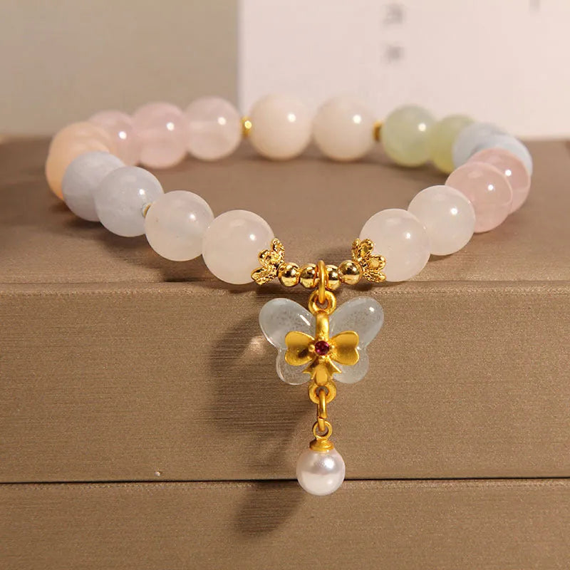 Women's crystal bracelet with natural Morganite butterfly pendant in colourful gemstone tones.