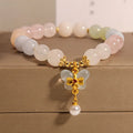 Women's crystal bracelet with natural Morganite butterfly pendant in colourful gemstone tones.