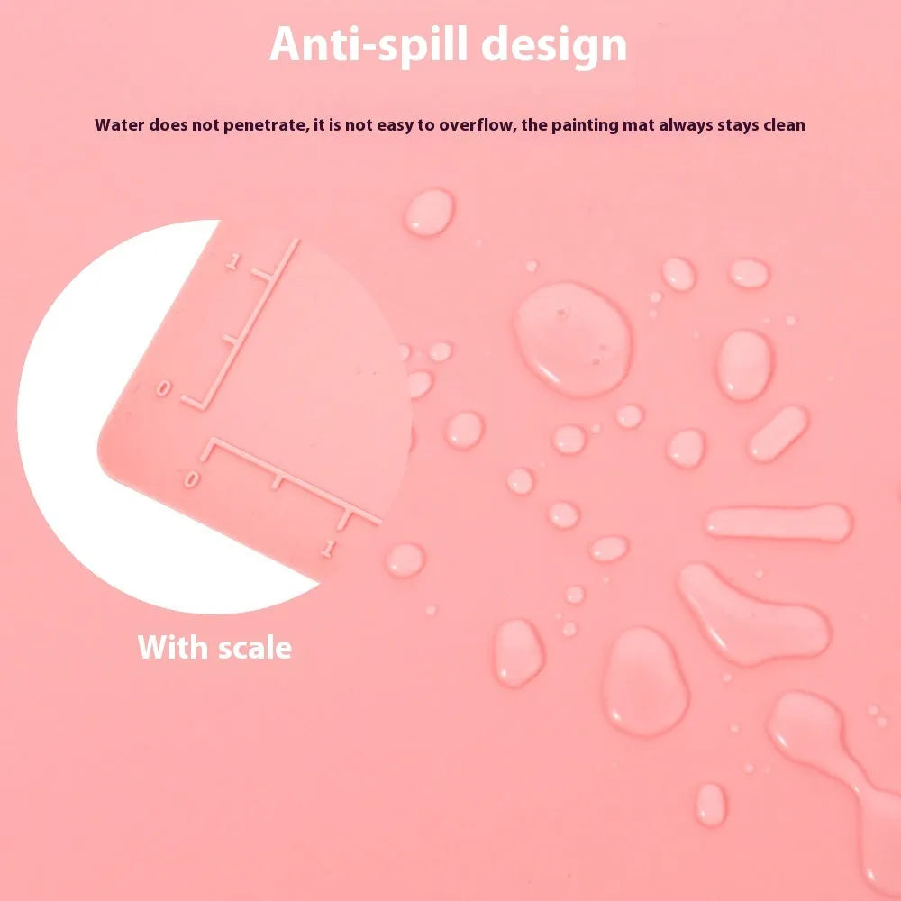 Light blue silicone painting mat with two round mixing bowls on 40x50cm surface