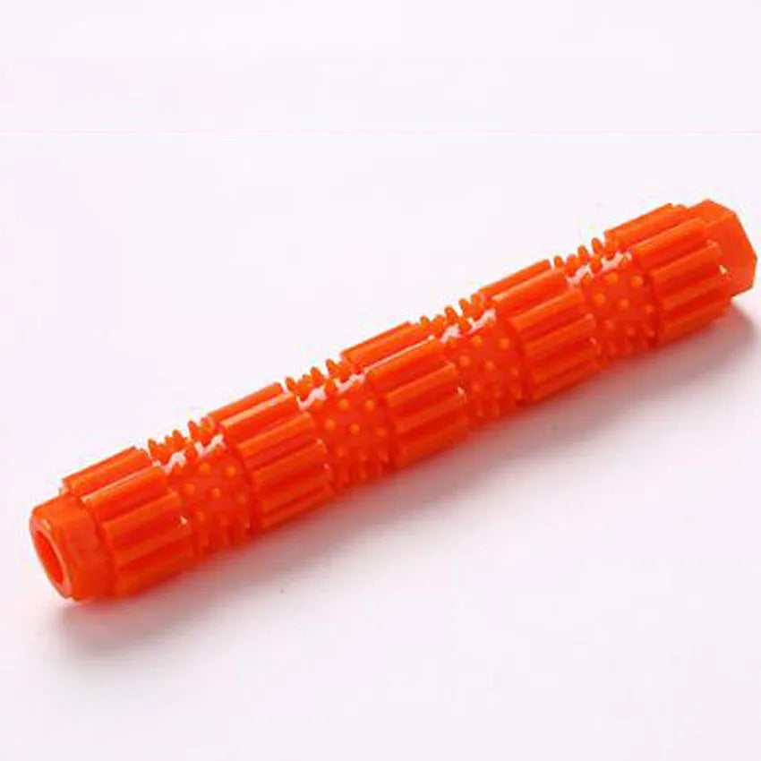 Green and orange rubber dog chew toy with treat dispensing opening and textured cleaning surfaces