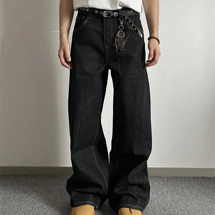 Black loose wide-leg straight-leg retro jeans on a hanger, showing zip fly and mid waist.