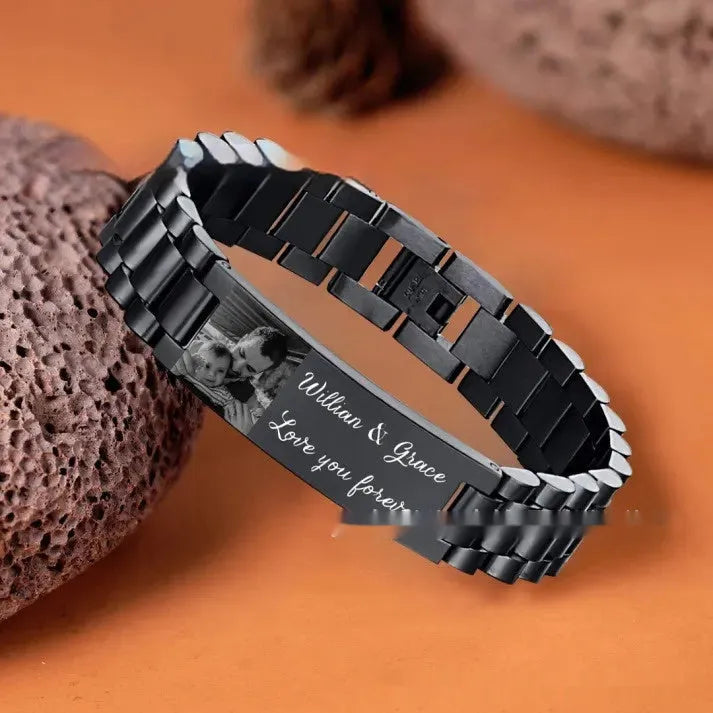 Titanium steel lettering bracelet with curved heart shape design showing black engraved lettering