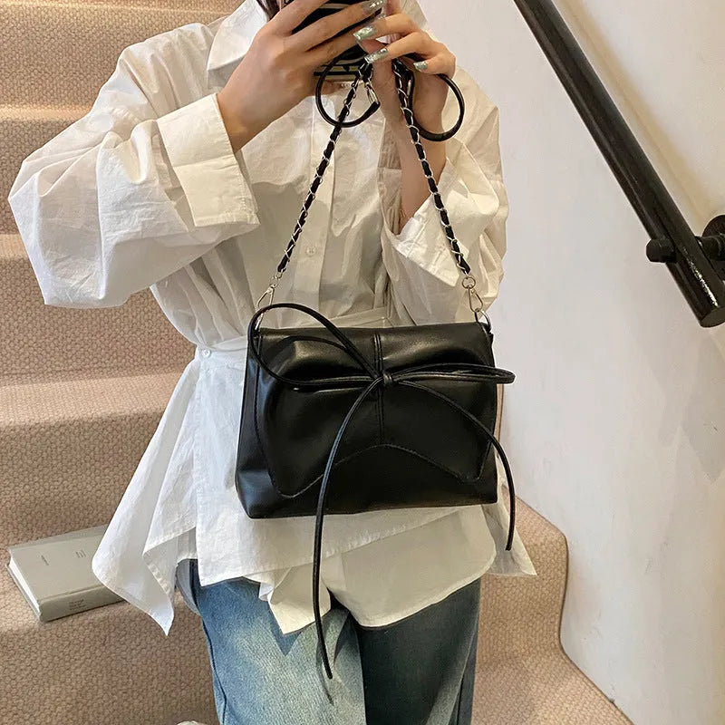 Women's black PU leather underarm crossbody bag with large capacity horizontal square shape and sewing line detailing