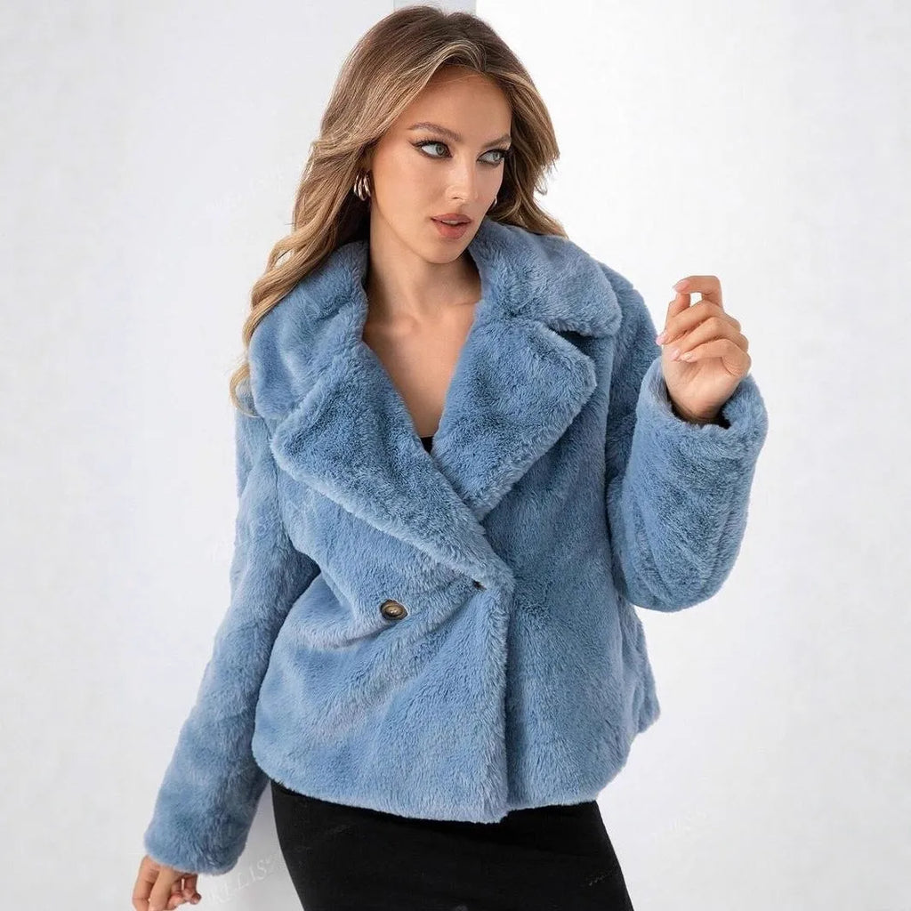 Women's loose-fitting short faux fur coat in rose red colour on a hanger.